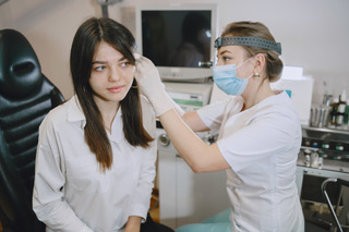 Otolaryngologist preparing for the medical examination procedure